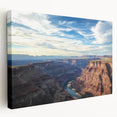 Stretched canvas artwork depicting a vibrant landscape of canyons with rich earthy tones, showcasing intricate details and depth, perfect for home decor.
