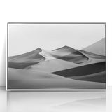 Framed acrylic artwork depicting serene sand dunes in a minimalist style, featuring soft beige and white tones, perfect for enhancing modern home decor.