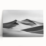 Stretched canvas artwork depicting serene sand dunes at sunset, showcasing warm hues of orange and gold, perfect for enhancing modern home decor or office spaces.