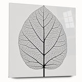 Large abstract wall art featuring close-up of leaves in green and yellow tones on acrylic glass.