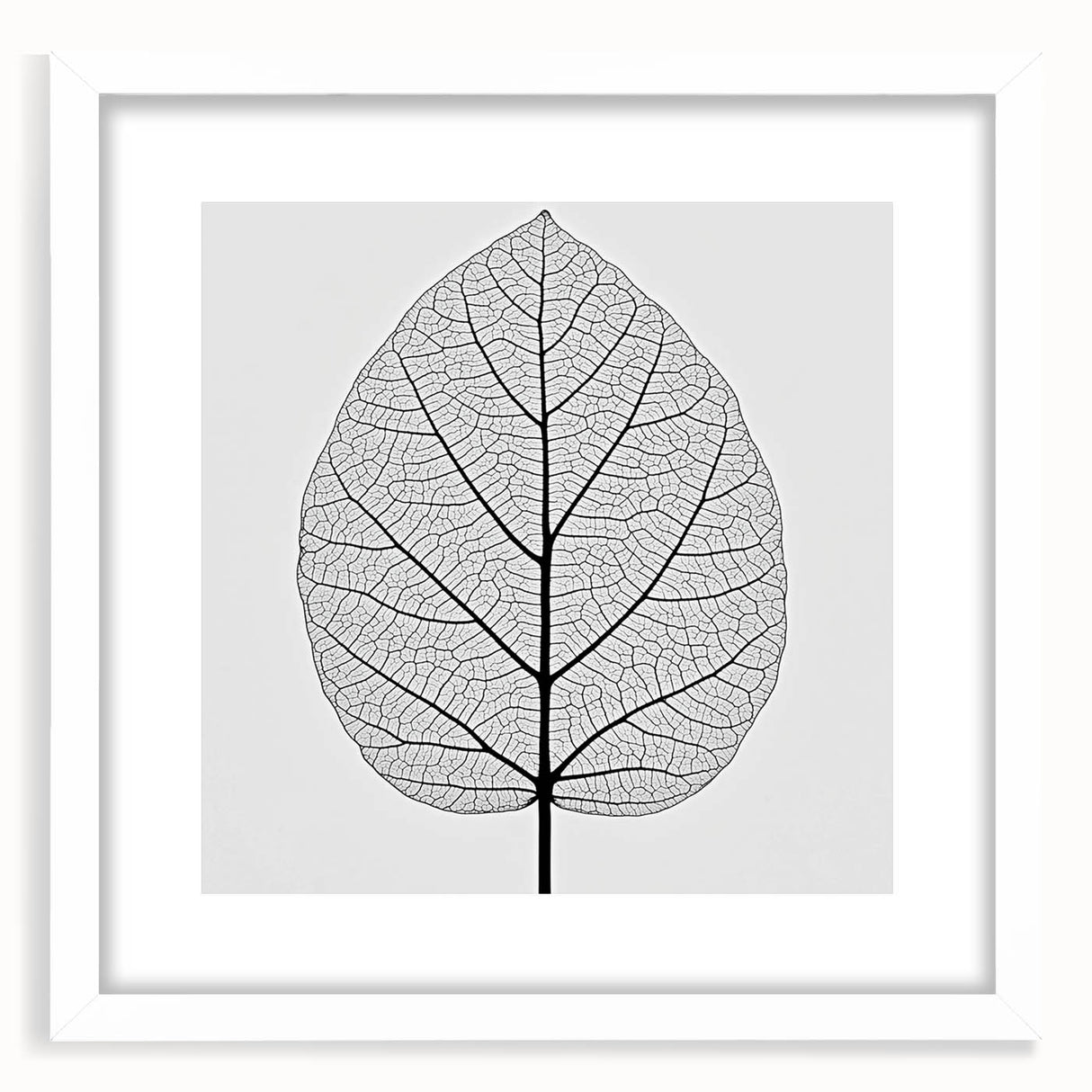 Abstract art print of close-up leaves in muted green and white, framed in white, ideal for dining room decor.