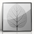 Large abstract wall art featuring close-up leaves in green and black, acrylic print in black frame.
