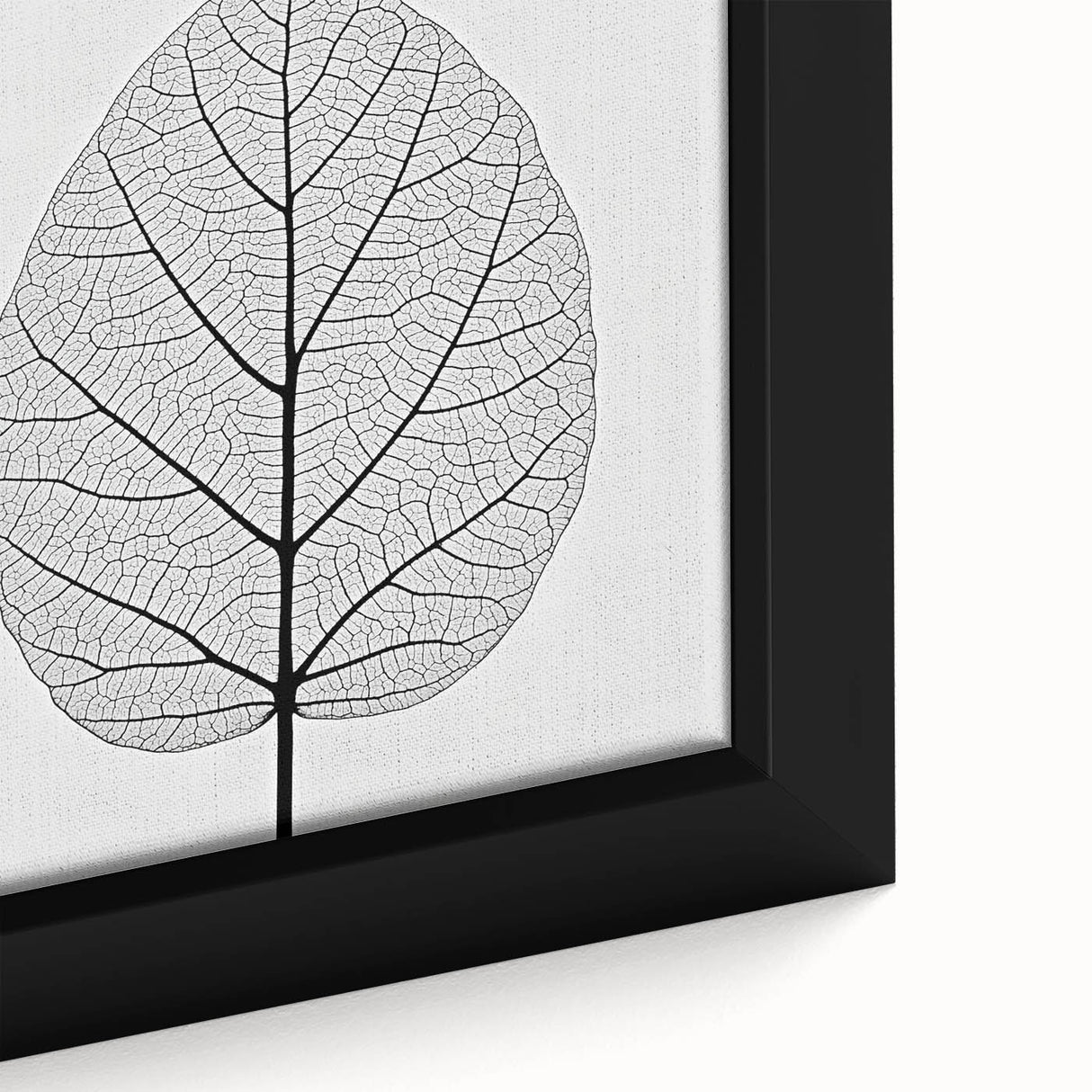 Close-up of textured leaves in vibrant green and yellow on a black framed canvas, ideal for living room decor.