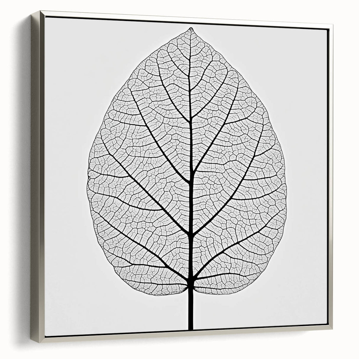 Framed canvas depicting a close-up of green leaves, ideal for adding a natural touch to a living room.