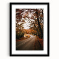 Colorful abstract art print featuring vibrant autumn shades on textured canvas, framed in black.