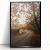 Large abstract wall art depicting autumnal trees in orange and red tones on a black acrylic framed print.