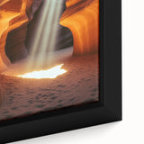 Close-up of a framed canvas artwork depicting a vibrant landscape scene with intricate cave formations, showcasing rich colors and textures ideal for home decor.