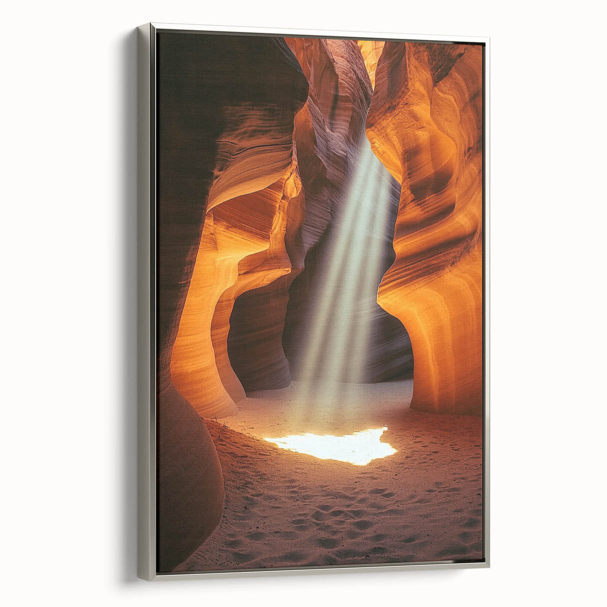 Framed canvas artwork depicting a serene landscape with caves, showcasing intricate details and a silver frame, perfect for enhancing modern home decor.