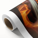 Rolled canvas showcasing a vibrant landscape scene with caves, featuring rich colors and intricate details, elegantly packaged in a protective tube for art enthusiasts.