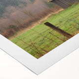 Rolled canvas showcasing a vibrant landscape barn design, featuring rich colors and intricate details, securely packaged in a protective cardboard tube for safe transport.