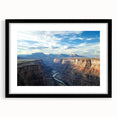 Framed landscape artwork showcasing vibrant canyons, with a sleek black mat surrounding it. Ideal for home decor, enhancing living spaces with natural beauty.