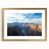 Elegant gold-framed landscape artwork showcasing vibrant canyons, complete with a white mat for a polished look, ideal for home or office decor.