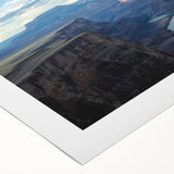 Vibrant rolled canvas showcasing a stunning landscape of canyons at sunset, featuring rich hues of orange and purple, perfect for home decor enthusiasts.