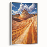 Framed canvas artwork depicting a serene desert landscape with warm hues of orange and beige, elegantly presented with a white frame, ideal for modern home decor.