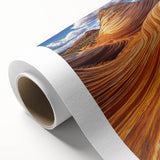 Desert landscape rolled canvas art showcasing vibrant orange and yellow hues, featuring a serene sunset over dunes, elegantly packaged in a protective tube.
