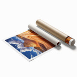Vibrant desert landscape rolled canvas print showcasing warm earth tones and dramatic cloud formations, elegantly packaged in a protective cardboard tube for easy transport.