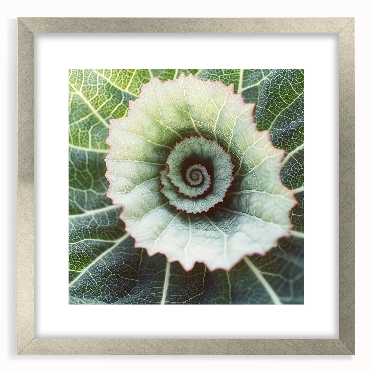 Close-up of textured art depicting abstract leaves in muted green tones, framed in silver, ideal for bedroom art.