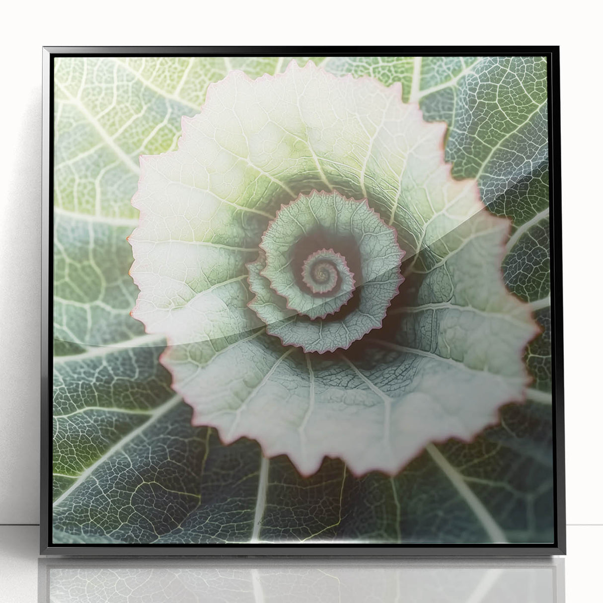 Large abstract wall art featuring close-up leaves in green and yellow, framed in black acrylic.