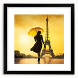 Colorful abstract art print of Paris scenery in vibrant hues on textured canvas, framed in black.