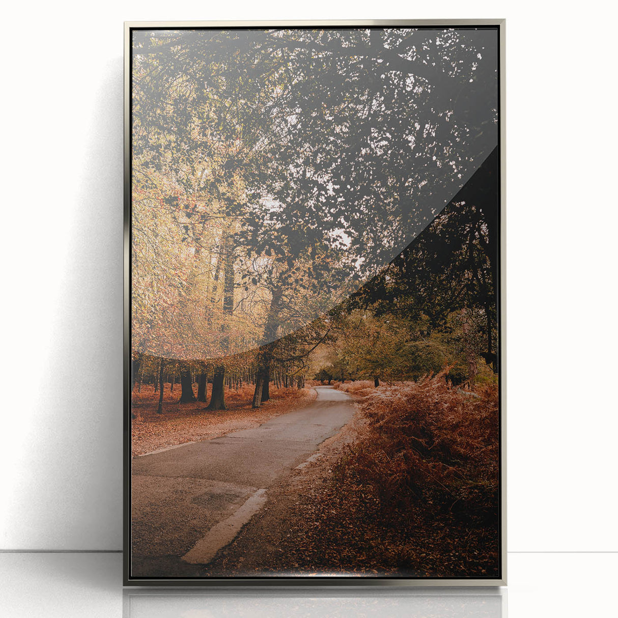 Mid-century modernist art depicting autumn trees in warm orange and red tones, framed in silver acrylic.