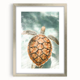 Textured abstract art print featuring swirling gray and white patterns on a silver framed canvas, suitable for bedroom decor.