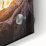 Close-up of an acrylic glass artwork depicting vibrant landscapes and intricate cave formations, showcasing rich textures and colors, ideal for modern decor.