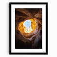 Framed landscape artwork showcasing a stunning cave scene, featuring a black mat and a sleek black frame, ideal for modern home decor. Perfect for nature lovers and art enthusiasts.