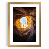 Elegant gold-framed landscape artwork featuring a serene cave scene with intricate details, perfect for home decor and enhancing interior aesthetics.
