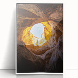 Framed acrylic artwork showcasing a stunning landscape of caves, featuring intricate details in earthy tones and a sleek white frame, perfect for modern decor.
