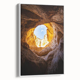 Framed canvas artwork showcasing a stunning cave landscape, featuring rich earth tones and intricate details, ideal for enhancing home decor with a natural aesthetic.