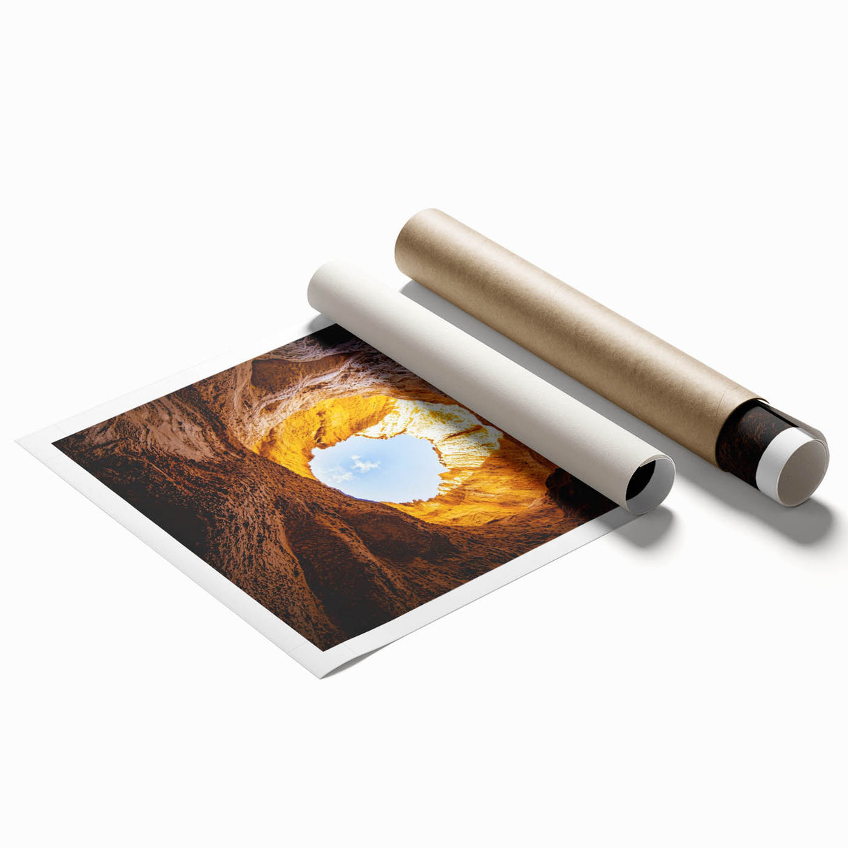 Vibrant rolled print depicting a stunning landscape with intricate cave formations, showcasing earthy tones and textures, packaged securely for display.