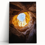 Stretched canvas artwork depicting a vibrant landscape with caves, showcasing rich colors and intricate details, ideal for home decor in nature-themed spaces.