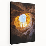 Stretched canvas artwork depicting a serene cave landscape with rich earthy tones and intricate details, ideal for home decor or art enthusiasts.