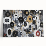 Abstract geometric stretched canvas art piece featuring vibrant colors and dynamic shapes, leaning against a neutral wall, ideal for modern home decor.