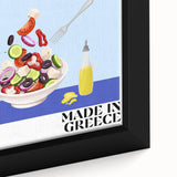 Close-up of a black framed canvas featuring a colorful, textured depiction of various food dishes.
