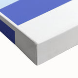 Large art of black and white landscape painting on stretched canvas, featuring assorted food dishes.