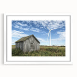 Barn frame landscape artwork displayed in a white mat, showcasing a rustic aesthetic with warm tones, perfect for enhancing home decor or office spaces.