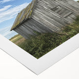 Rolled canvas artwork showcasing a vibrant landscape with a rustic barn, wrapped securely in a protective cardboard tube, ideal for home decor enthusiasts.