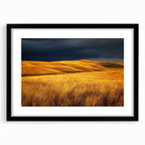Framed landscape art showcasing a serene countryside scene, featuring lush green fields and a clear blue sky, presented in a sleek black frame with a mat.