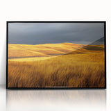 Framed acrylic artwork showcasing a serene countryside landscape with vibrant green fields and a blue sky, set in a sleek black frame, perfect for home decor.