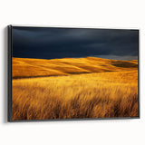 Framed canvas artwork depicting a serene countryside landscape in vibrant colors, featuring rolling hills and a blue sky, showcased from a black side view angle.