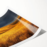 Vibrant countryside landscape print rolled up for display, showcasing lush green hills and a serene blue sky, ideal for home decor or art enthusiasts.