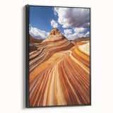 Framed canvas artwork depicting a vibrant desert landscape with warm hues of orange and yellow, showcasing intricate details and textures against a black frame, ideal for home decor.