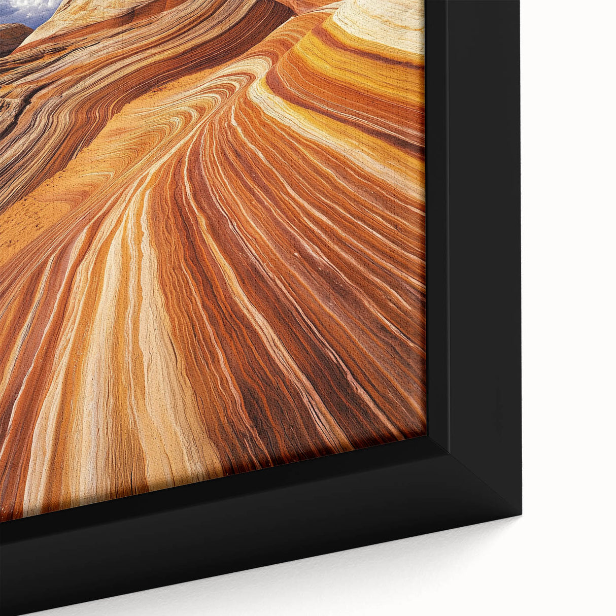 Close-up of a framed canvas depicting a vibrant desert landscape with warm earth tones, showcasing intricate details of sand dunes and sparse vegetation, perfect for home decor.