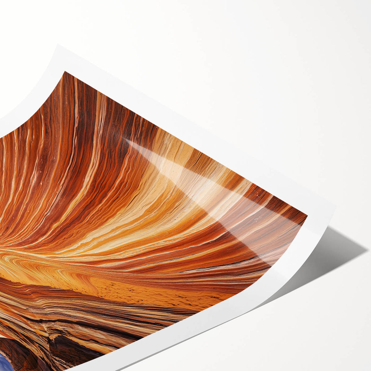 Desert landscape rolled print showcasing vibrant hues of orange and gold with dramatic mountain silhouettes, packaged securely in a durable cardboard tube for safe shipping.