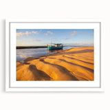 Abstract art print of a stylized Brazilian landscape in vibrant green and blue tones on a framed white mat.