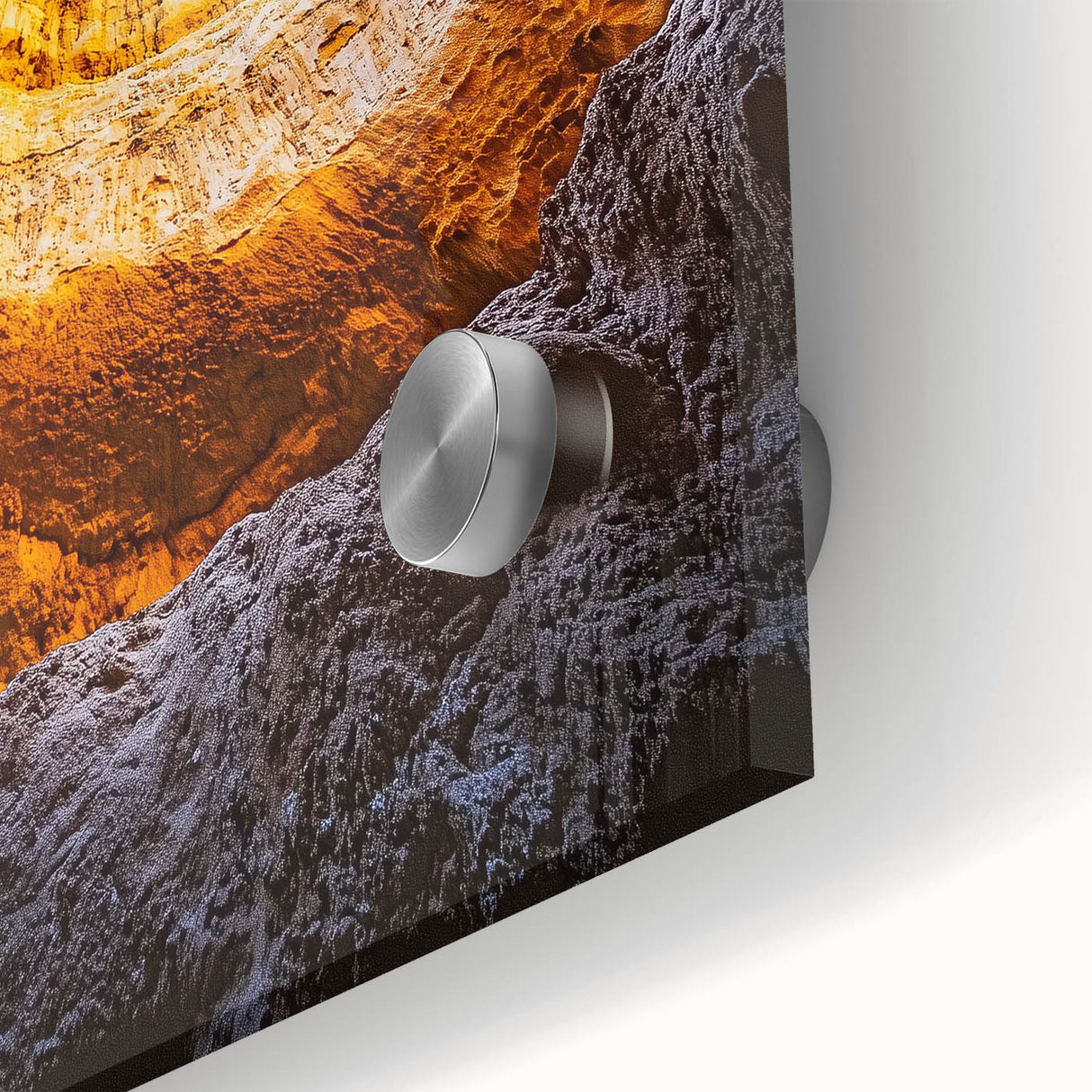 Close-up view of an acrylic glass art piece depicting a colorful landscape with intricate cave details, perfect for modern home decor and artistic displays.
