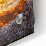 Close-up view of an acrylic glass art piece depicting a colorful landscape with intricate cave details, perfect for modern home decor and artistic displays.