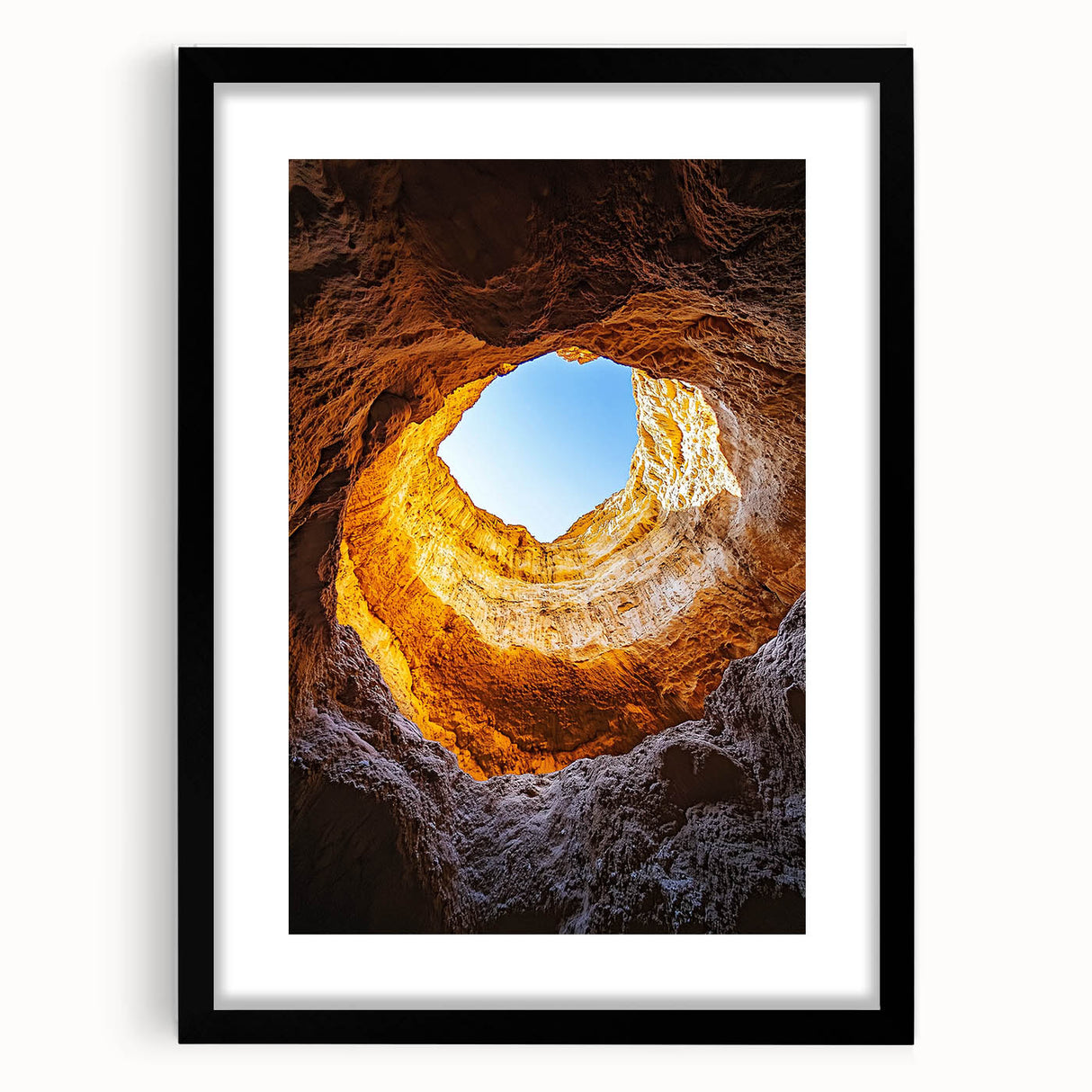 Framed landscape artwork featuring intricate cave designs with a sleek black mat, ideal for home decor. Perfect for nature lovers and art enthusiasts alike.