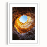 Framed landscape artwork showcasing a scenic cave view with a white matting, designed to enhance home decor aesthetics while adding a touch of nature-inspired elegance.
